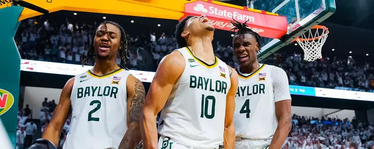 Jayden Nunn, RayJ Dennis and Ja'Kobe Walter celebrate against Kansas