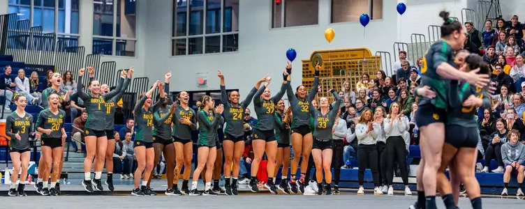 Team celebrates acro heat three against Augustana