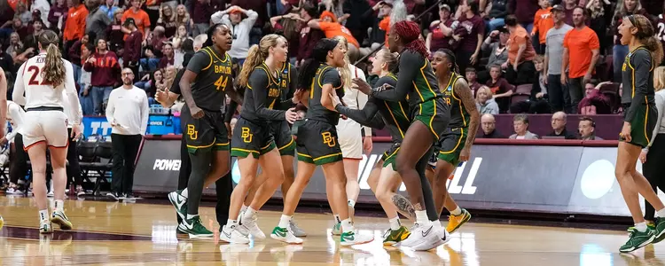 Jada Walker banks a shot from half court to end the third quarter against Virginia Tech