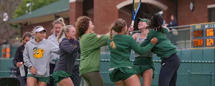 Women's tennis team celebration vs Kansas
