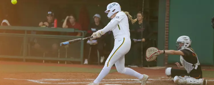 Leah Cran hitting against Iowa State