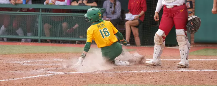 Presleigh Pilon sliding into home against Iowa State