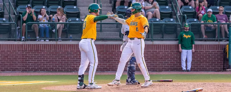 Will Pendergrass hugs Wesley Jordan after hitting a home run against ORU 2024