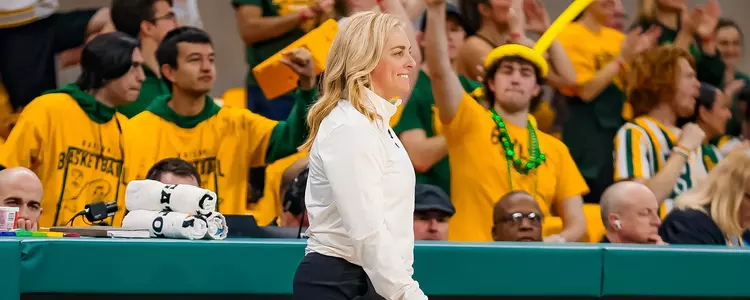 Nicki Collen smiles against Oklahoma State