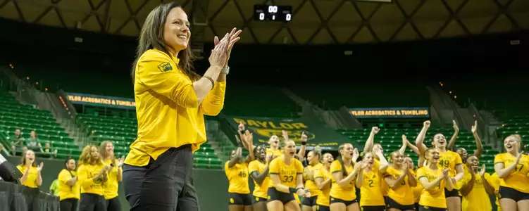 Felecia Mulkey looks on with her team behind her against Oregon