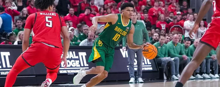 RayJ Dennis drives against TTU