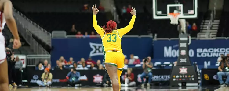Aijha Blackwell celebrating a three against Iowa State