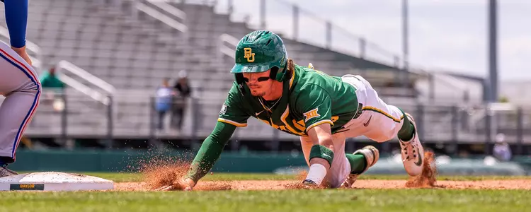 Ty Johnson sliding back into first base vs. Kansas 2024