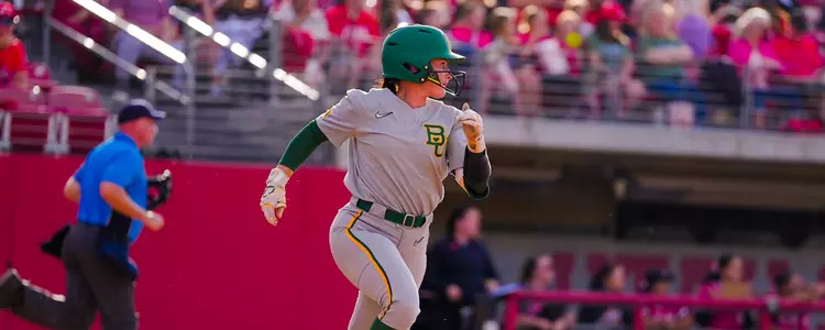Kaci West running to first base against Utah