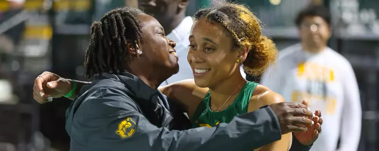 Alexis Brown hugging Stacey Smith after winning 2024 Big 12 Championship