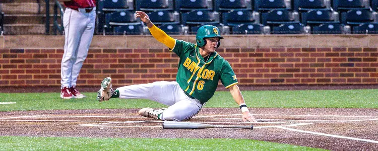 Cole Posey sliding home safely at Oklahoma 2024