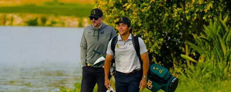 Zach Heffernan and Coach Alcorn Walking across the bridge