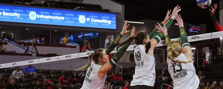 Murphy, Andrew and Simpson go up for a block against Cincinnati