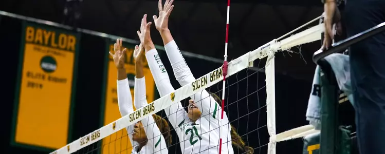Victoria Davis and Elise McGhee go up for the block against ACU