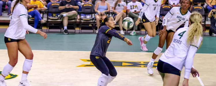 Lauren Briseño digs against Texas A&M