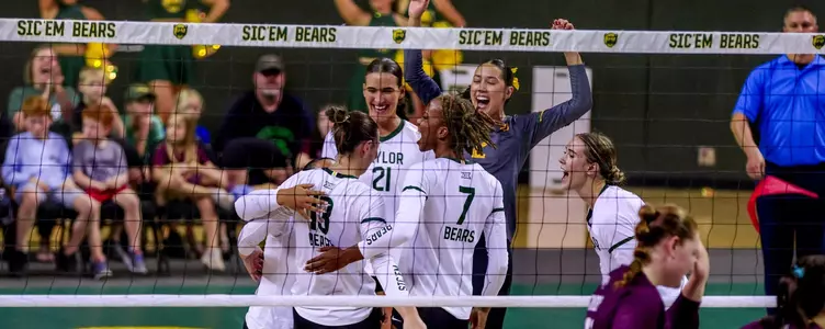 Davis, Barrett Frazier and the team celebrate against the Aggies