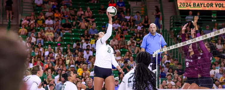 Elise McGhee hits against the Aggies