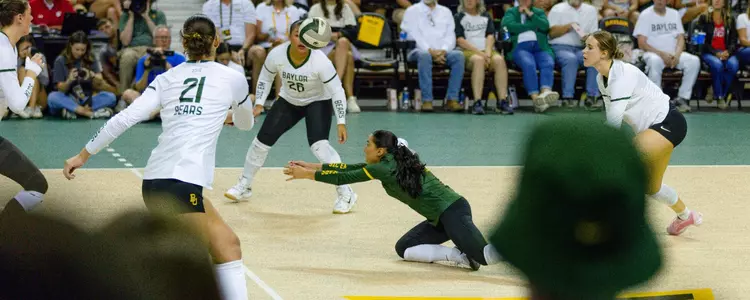 Lauren Briseño digs against Wisconsin