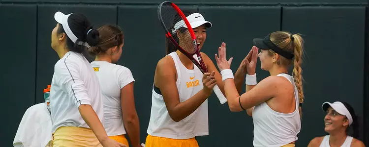 Wenfei, Luba high five before season opener against Harvard