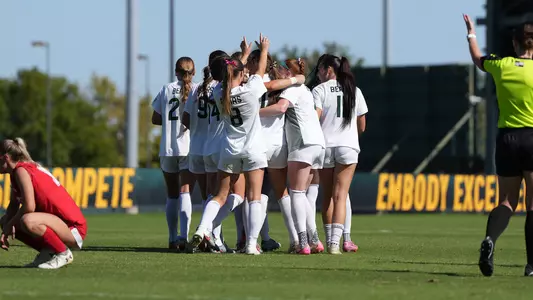 Team huddle after goal in Utah win 2025