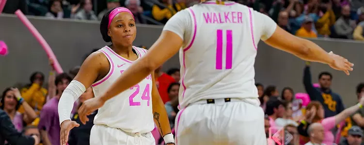 Sarah Andrews high-fives Jada Walker against ISU