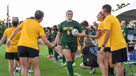Callie Conrad runs through team tunnel for team intros 2025