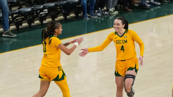 Taliah Scott and Jana Van Gytenbeek high five vs UCF