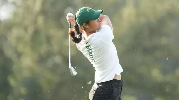 Amelia Wan swinging a golf club