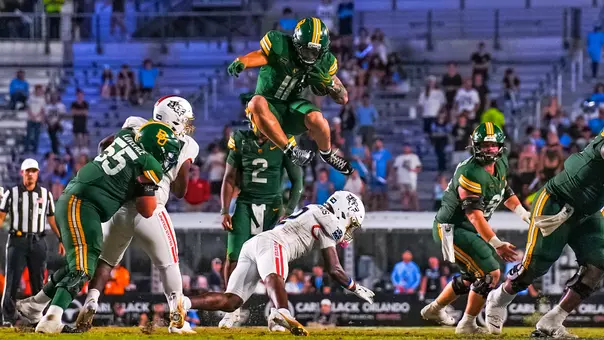 Caden Knighten jumps over a UCF defender 2026