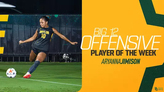 Baylor soccer player Aryanna Jimison, wearing a black No. 10 jersey, winds up to strike the ball on a wet, floodlit field. Text beside her reads "Big 12 Offensive Player of the Week, Aryanna Jimison" on a gold background with green accents and the Baylor and Big 12 logos in the corner.