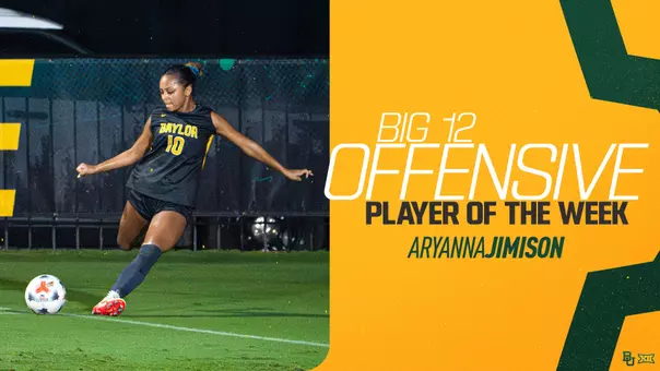 Baylor soccer player Aryanna Jimison, wearing a black No. 10 jersey, winds up to strike the ball on a wet, floodlit field. Text beside her reads "Big 12 Offensive Player of the Week, Aryanna Jimison" on a gold background with green accents and the Baylor and Big 12 logos in the corner.