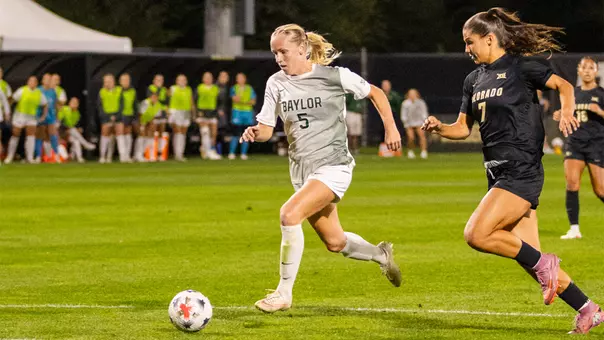 Lauren Omholt dribbles at Colorado