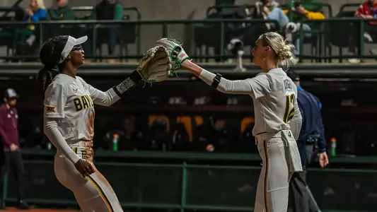 Cambree Creager and Brooklyn Carter High Five against MSU