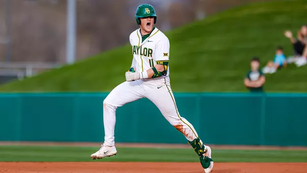 Tyce Armstrong rounding first base after hitting a grand slam 2026