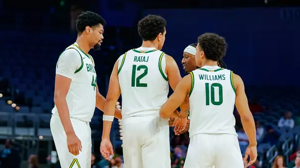 Group huddle vs Louisville in Dickies Arena