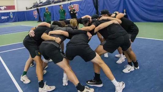 Team Huddle at ITA Indoor Semifinals vs Texas
