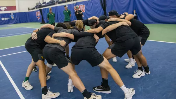 Team Huddle at ITA Indoor Semifinals vs Texas