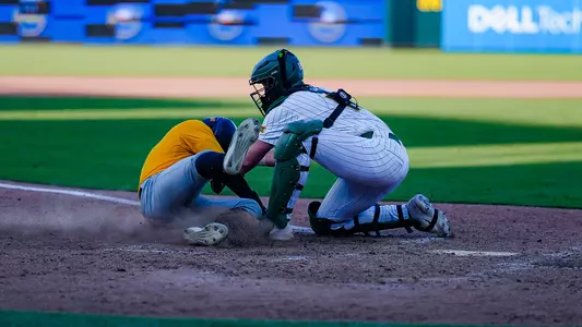 Brayden Buchanan tagging a runner out at the plate against Southern Miss 2026