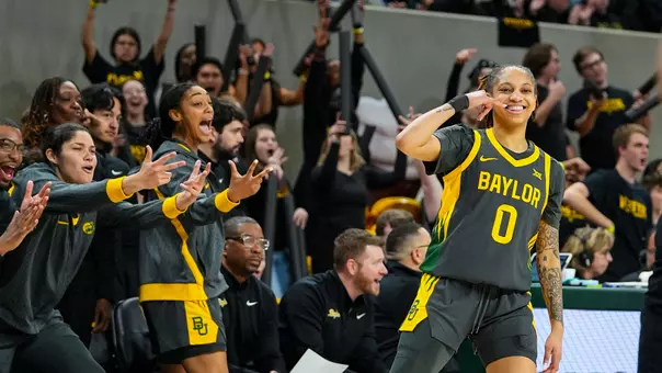Taliah Scott and Bench celebrate 3-pointer vs K-State