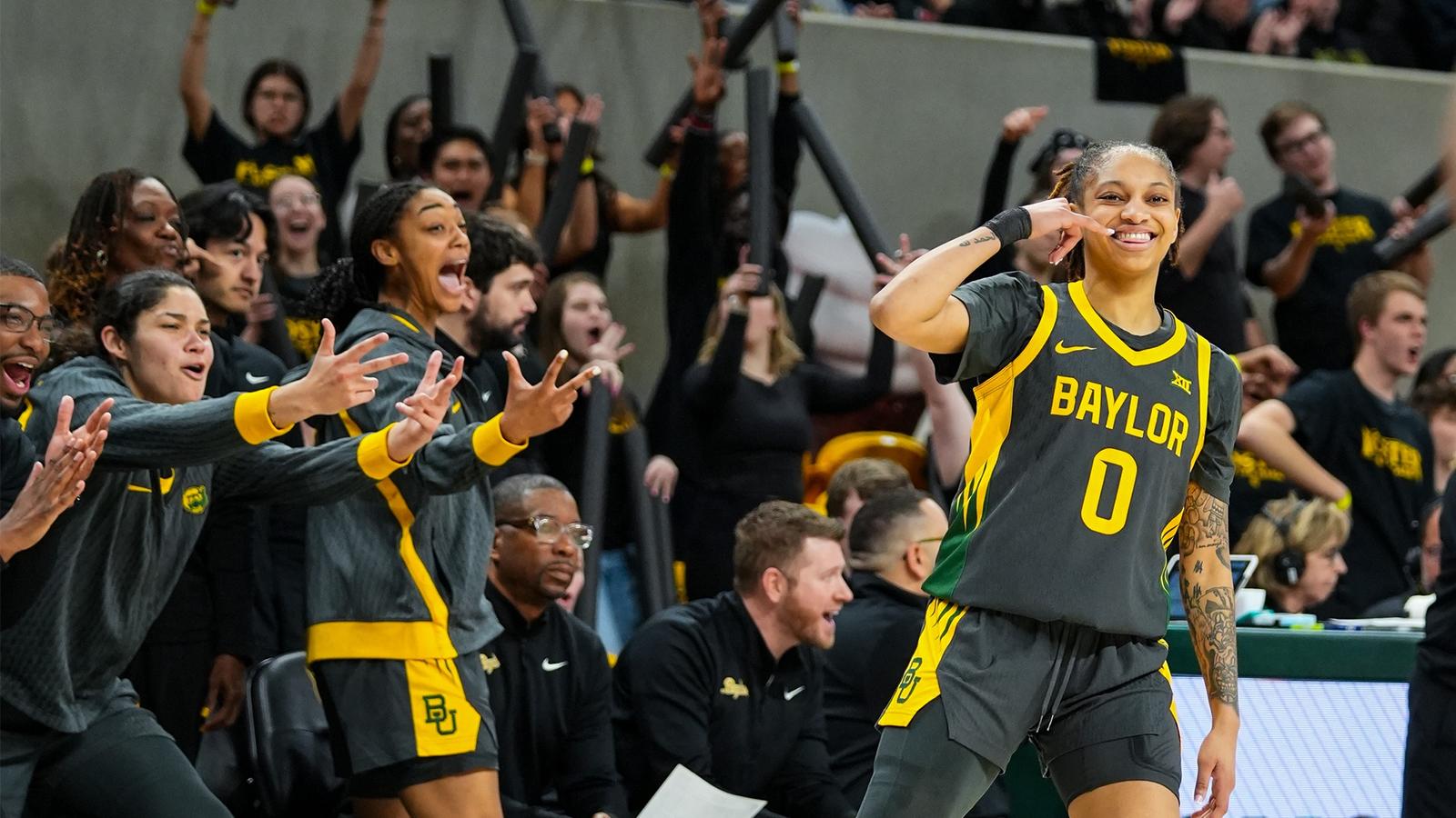 Taliah Scott and Bench celebrate 3-pointer vs K-State