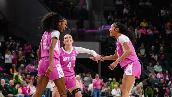 Darianna Littlepage-Buggs, Kiersten Johnson and Jana Van Gytenbeek celebrate vs Arizona State