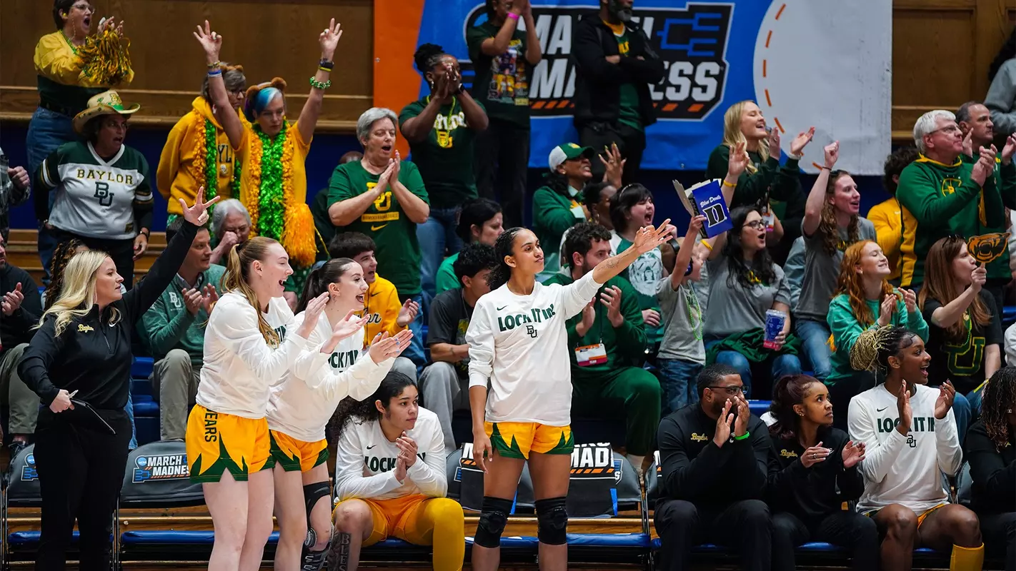 Crowd and bench celebrate a 3 in the 2026 NCAA Tournament first round vs Nebraska