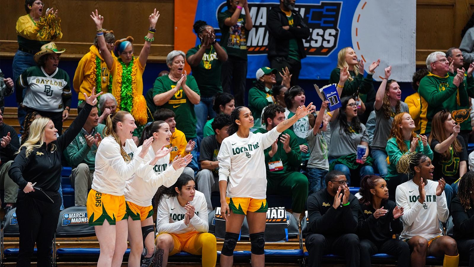 Crowd and bench celebrate a 3 in the 2026 NCAA Tournament first round vs Nebraska