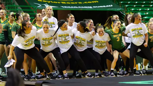 Team celebrating on the sidelines