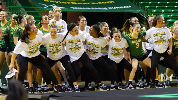 Team celebrating on the sidelines