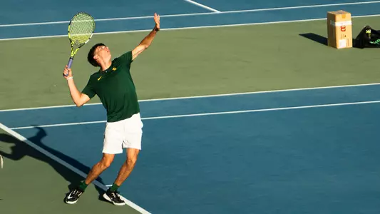 Blake Anderson serving at USTA Campus practice round
