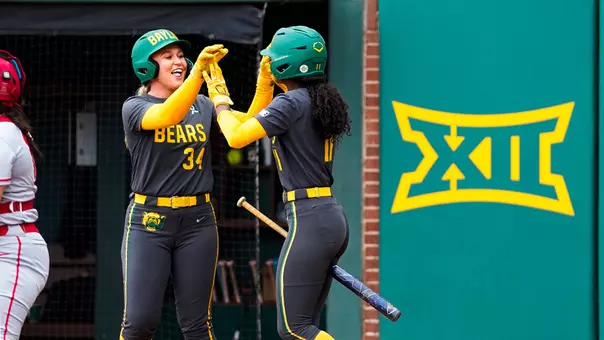 Jensen Vienne and Brooklyn Carter High Five in a game against Houston