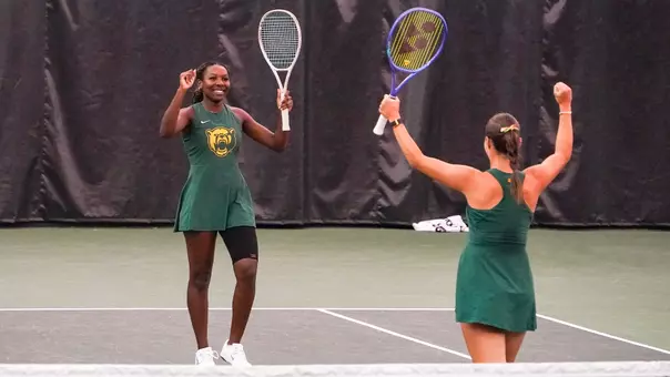 Kennedy Gibbs celebrates doubles point in the Hawkins Indoor over Utah