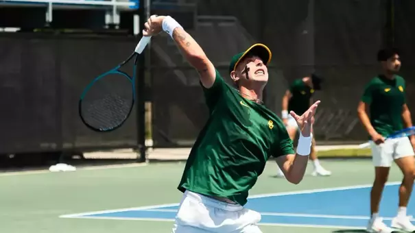 Alex Chirita hits a ball overhead during a men's tennis match in Orlando