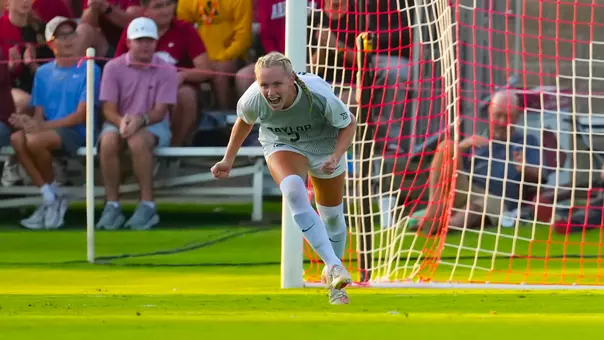 Lauren Omholt celebrates PK goal at Arkansas